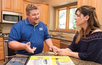 Mike, one of our Ceres plumbers, is talking with the customer regarding the homeowner agreement